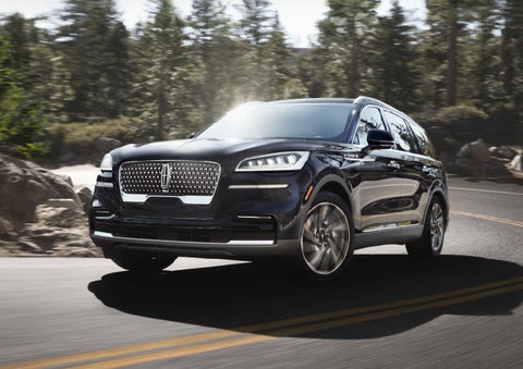 A Lincoln Aviator® SUV is being driven on a winding mountain road | Beck Lincoln in Palatka FL