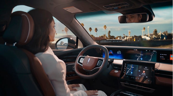 A person is shown driving hands-free on the highway with available Lincoln BlueCruise technology. | Beck Lincoln in Palatka FL